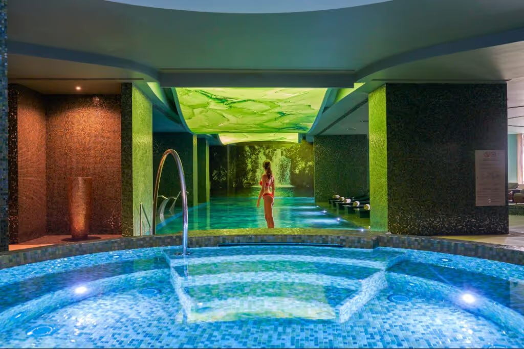 This Luxurious Boutique Hotel Is Located on Portugal’s Most Underrated Destination | Savoy Palace Madeira hotel pool | Savoy Palace Madeira bedroom suite | Savoy Palace Madeira Galáxia restaurant