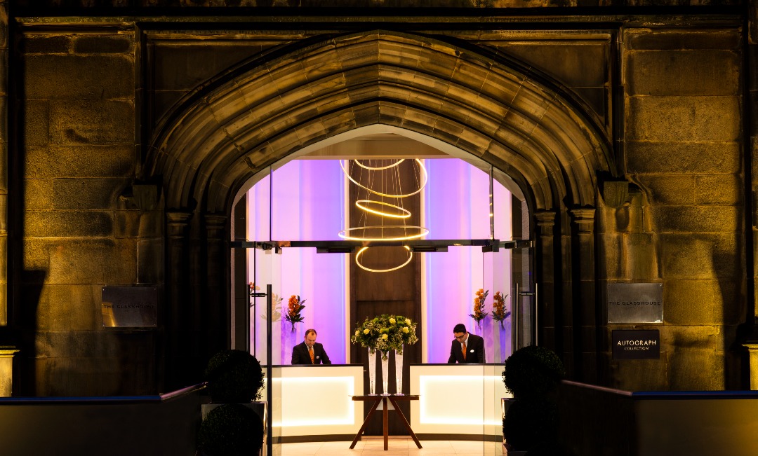 Cozy Up with 160+ Whiskies Around an Indoor Fire Pit at This Boutique Edinburgh Hotel | The Glasshouse Hotel exterior | The Glasshouse Hotel entrance | The Glasshouse Hotel restaurant | The Glasshouse Hotel bedroom suite | The Glasshouse Hotel tasting hall | The Glasshouse Hotel yard