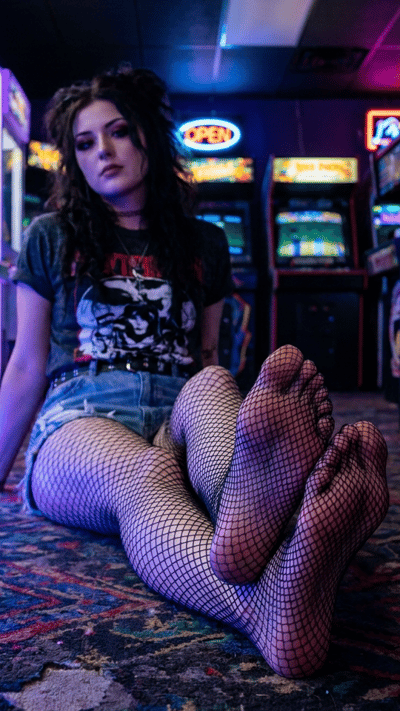 Glowing Neon Setup Where Her Bare Feet Distract You Completely
