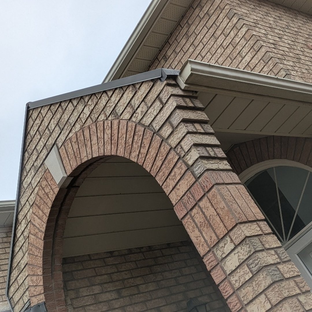 Before and after brick repair showing restored wall section