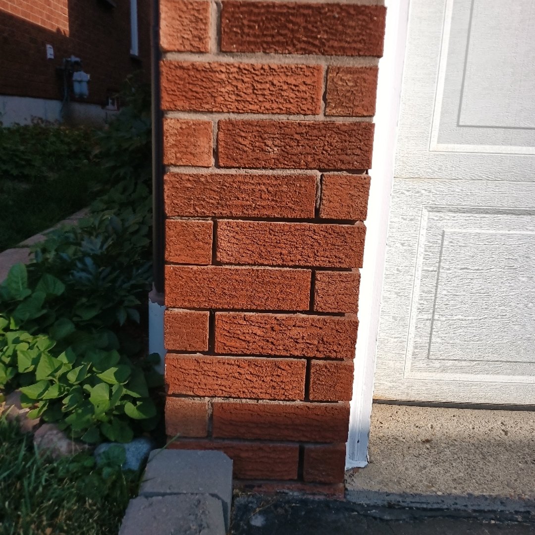 Before brick repair - damaged brickwork and mortar