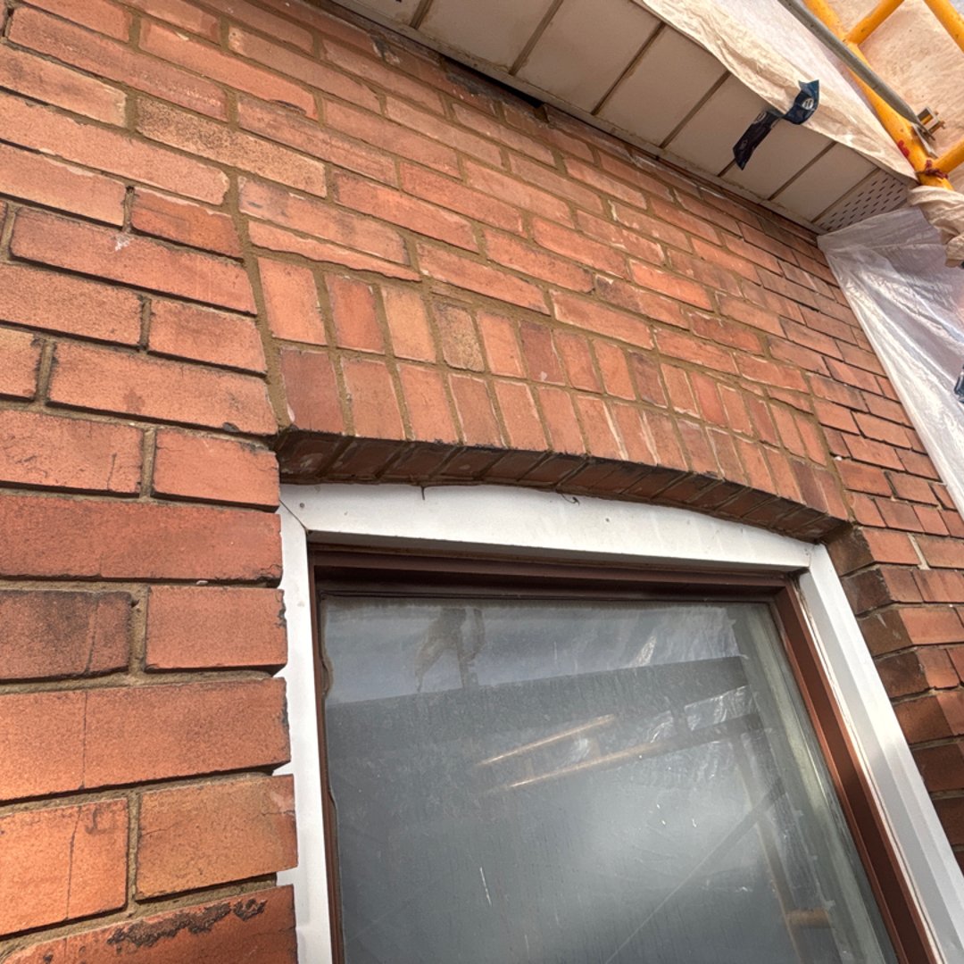 Brick repair with matched mortar joints and replaced units