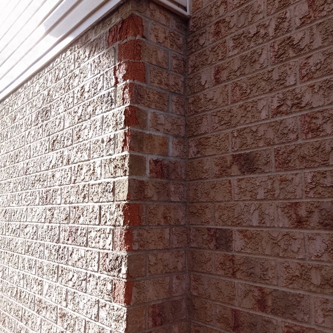 Before brick repair - worn and damaged brickwork