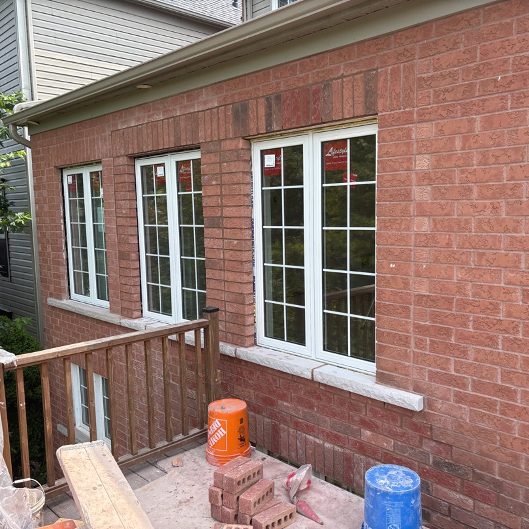 Block repair showing CMU replacement and repointing