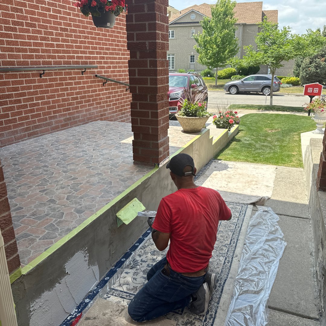 Mason actively working on masonry repair - attention to detail