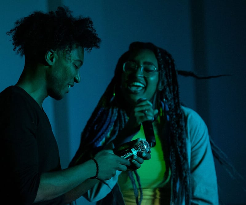 Students speaking into microphone