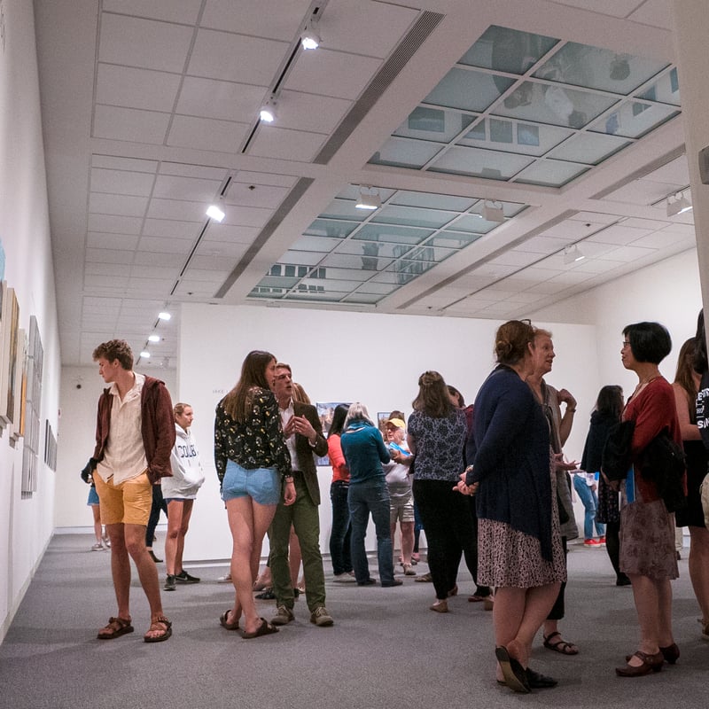 people in a gallery looking at art