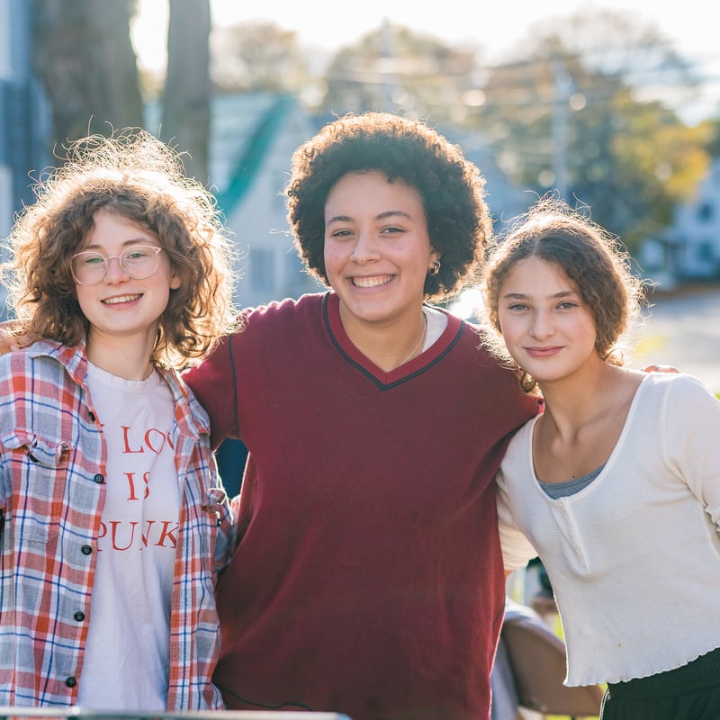 Three girls posing together for a photo