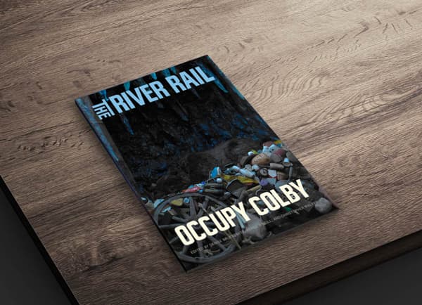 Photograph of "The River Rail" with "Occupy Colby" written across the bottom of the cover.