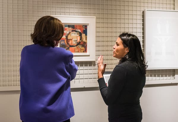 Adrienne Childs (left) and Rebecca VanDiver (right) discuss David Driskell’s Of Thee I Weep during their visit to the Colby College Museum of Art in November of 2019.