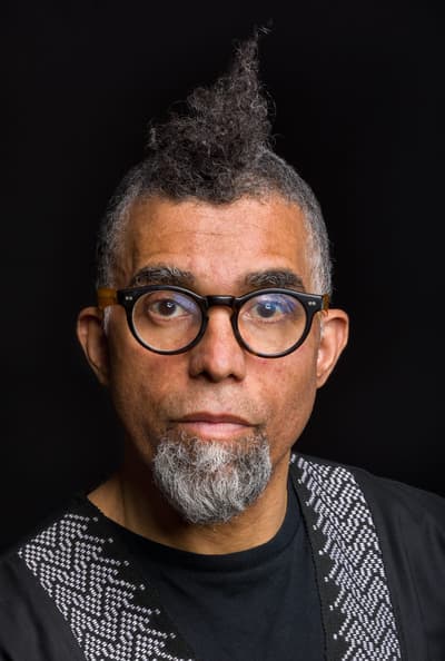 Dread Scott faces the camera directly and unsmiling.