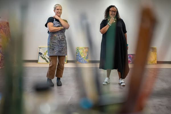 Executive Director of the Lunder Institute for American Art Erica Wall (right) talks with artist Tessa Greene O’Brien about her work at the Greene Block + Studios, the institute's home base.