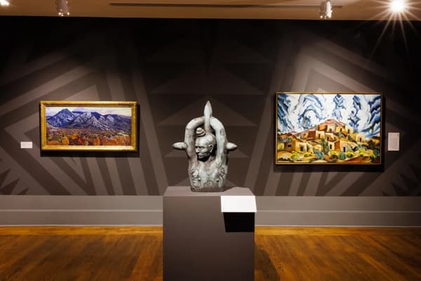 Installation view of Painted: Our Bodies, Hearts, and Village” at Colby College Museum of Art, highlighting Virgil Ortiz's Omtua.