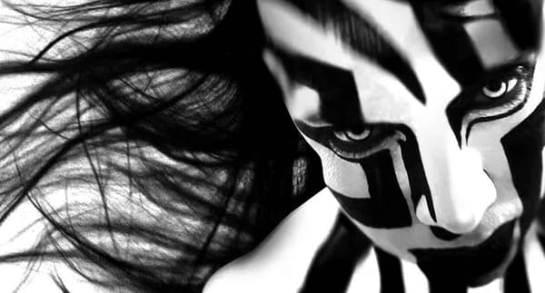 Artwork depicting a figurewith geometric patterns on their face in in black and white