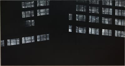 A painting by Alex Katz of building windows at night.