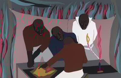 Four figures standing around a table pointing and looking at an object on the table between them.