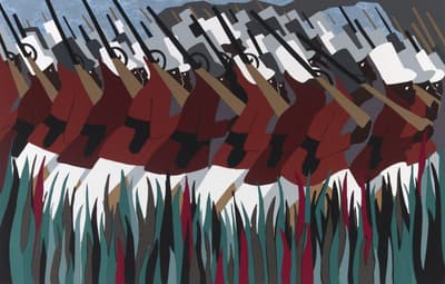 A large number of soldier marching in front of large blades of grass.