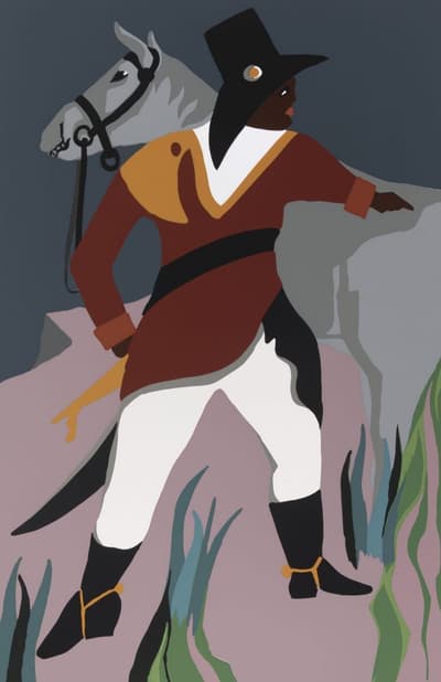 A man in uniform pointing in front of a grey horse.