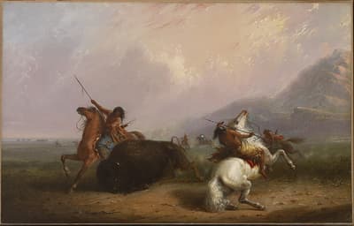 An oil on canvas of two men riding horses and killing a buffalo.