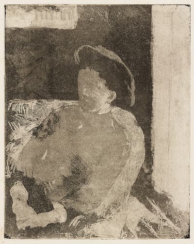 A woman with an obscured face wearing a hat sitting in a chair looking towards the left with her hands in her lap.
