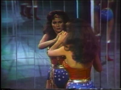 A video still from a piece by Dara BIrnbaum titled Technology/Transformation Wonder Woman. The still depicts Lynda Carter as Wonder Woman right after she has transformed into the superhero, 1978.