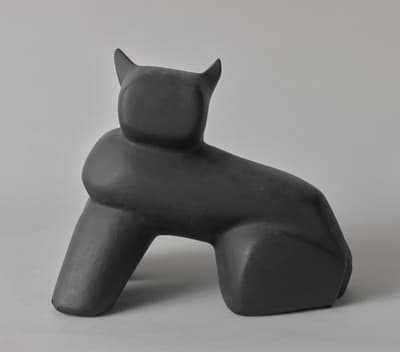 An abstract sculpture painted black.