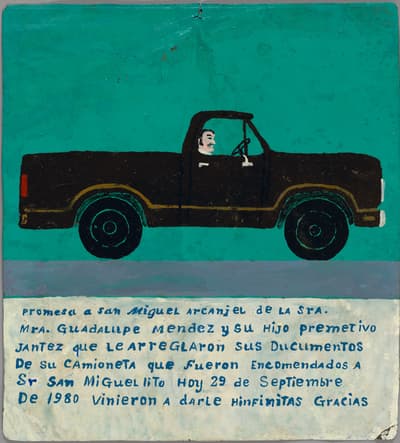 A man driving a dark pickup truck against a blue background above a large block of text.