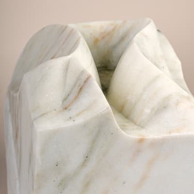 A close up image of a curved marble sculpture.
