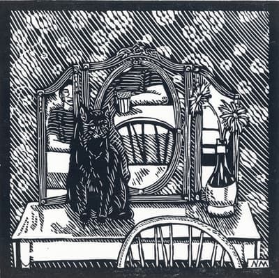 Woodcut print of a cat sitting on top of a desk, in front of a mirror, and next to a vase with flowers.