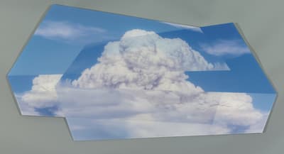 Geometric shapes featuring a sky with cumulus clouds against a gray background.
