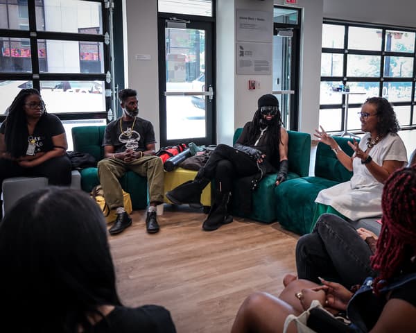 A group of individuals on couches in conversation