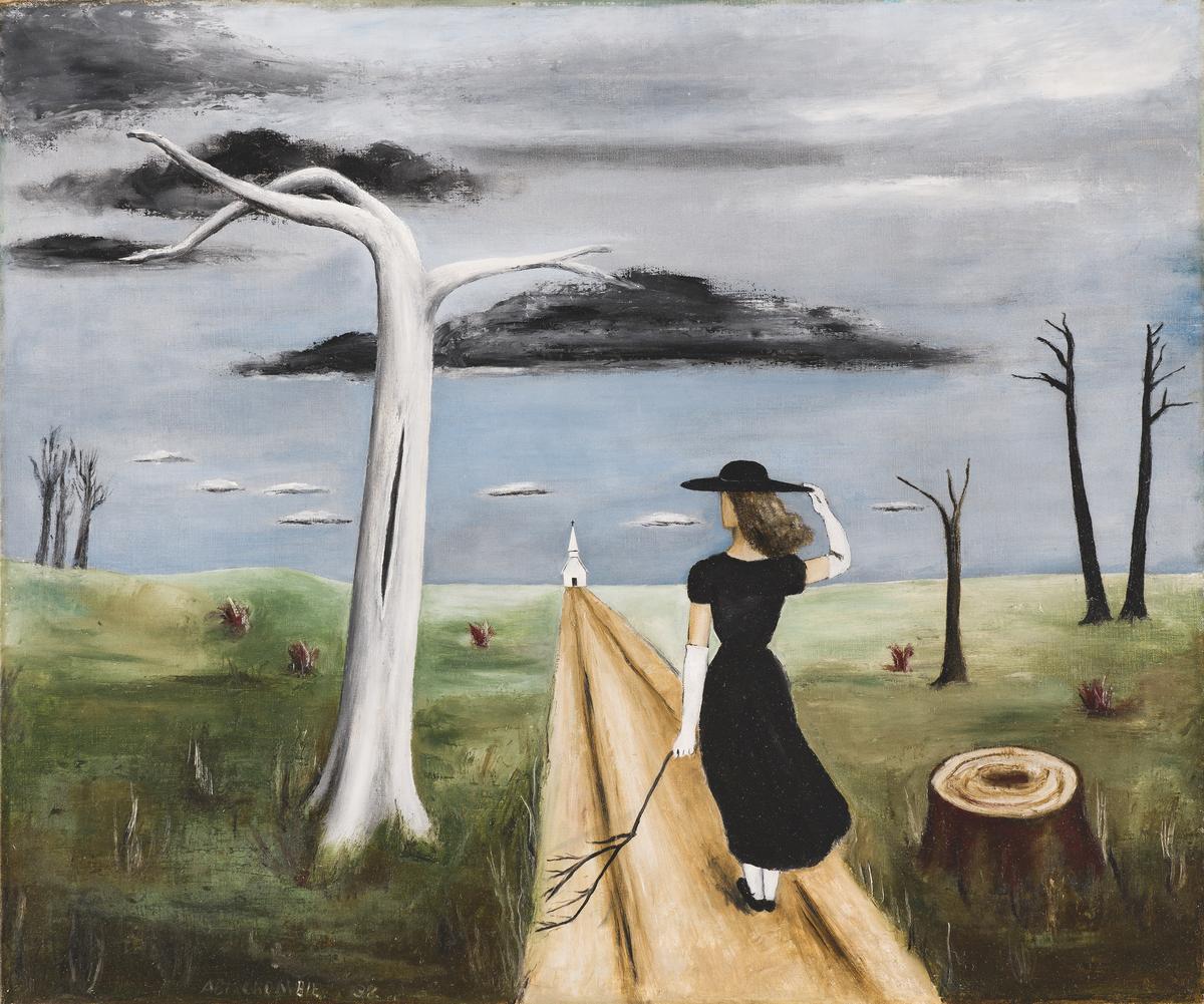A woman in a black dress walks towards a distant church on a wooden path in a barren landscape under a gray sky.