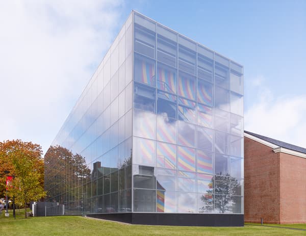 Exterior of Colby Museum with Sol LeWitt wall drawing visible through glass.