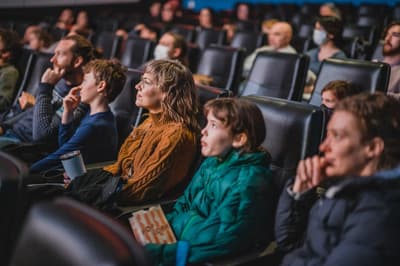 People seated in movie theater