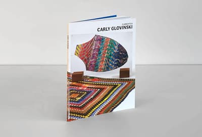 Currents 8: Carly Glovinksi publication standing on tabletop to display front cover