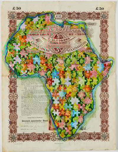 Acrylic painting of the outline of Africa, patterned with a puzzle of floral designs.
