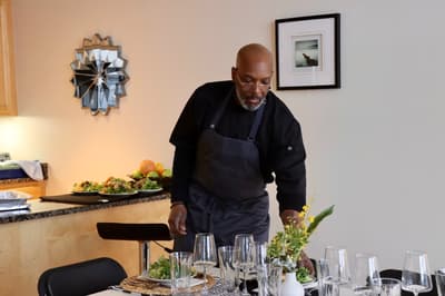 Man setting table.