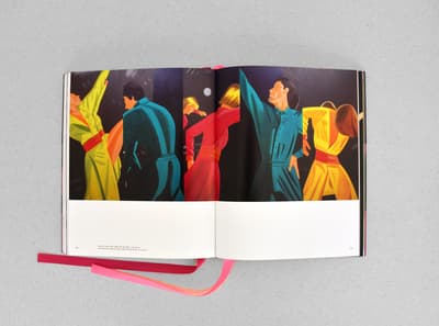 Open book displaying a colorful painting of stylized figures in dynamic dance poses.
