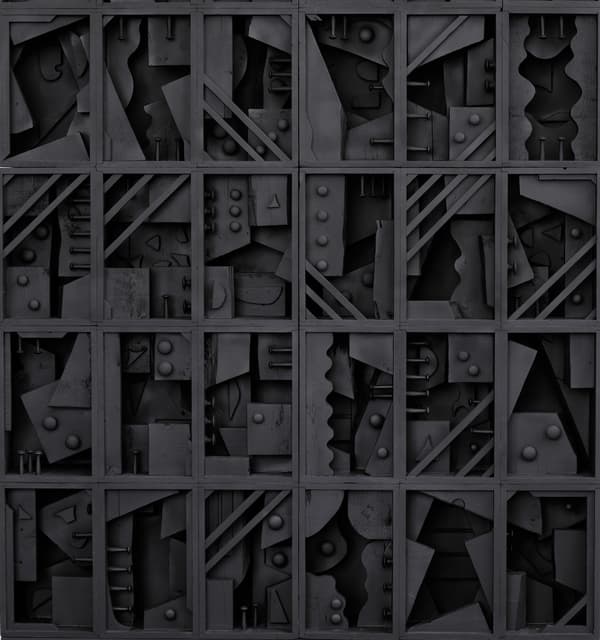 A 1979 constructed, wooden sculpture that is painted black by Louise Nevelson.