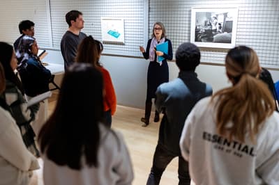 Professor leading class in teaching gallery