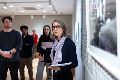 Professor leading class in teaching gallery