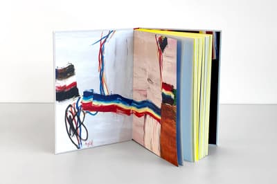 Roy Lichtenstein: History in the Making, 1948–1960 publication standing up on tabletop displaying inside cover art