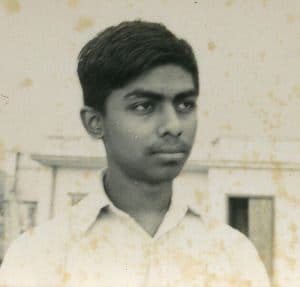 Portrait of young man looking away from camera.