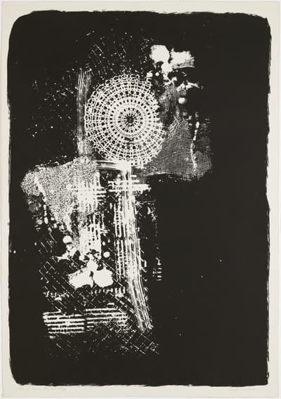 Abstract artwork with a black background and white circular, textural patterns.