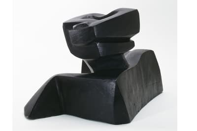 An abstract plaster sculpture painted black by Louise Nevelson c. 1935.