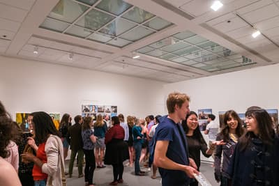 Guests at an exhibition opening celebration