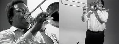 Still from two-channel video showing a musician playing trombone.