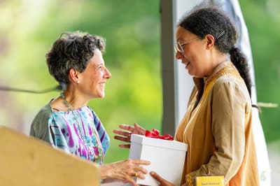 Jackie Terrasa, Colby Museum of Art director, smiles with Sarah Workneh after Workneh was awarded the Jette Award for Leadership in the Arts during the Museum Summer Luncheon on Saturday, July 13, 2024.