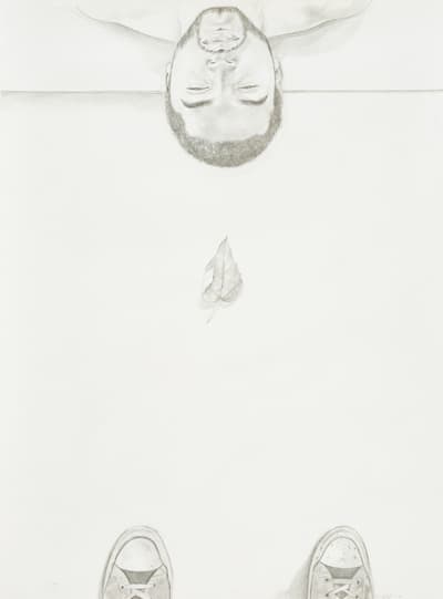 Pencil drawing of an upside-down face, leaf, and sneakers.