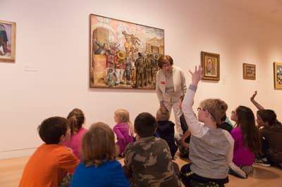 Elementary school class seated in gallery
